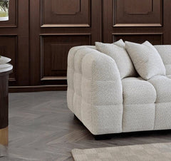 Side view of Tribeca L-shaped corner sofa in oatmeal bouclé showing chaise section - SOLID FURNITURE LTD