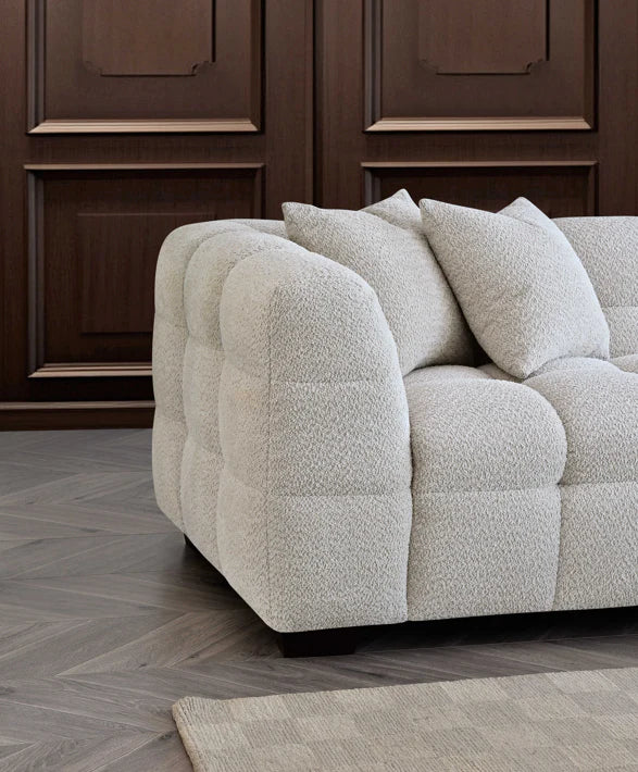 Side corner view of Tribeca Sofa Range in oatmeal boucle fabric solid furniture UK