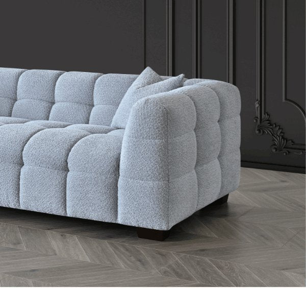 Side corner view of Tribeca sofa in pearl bouclé fabric - SOLID FURNITURE LTD