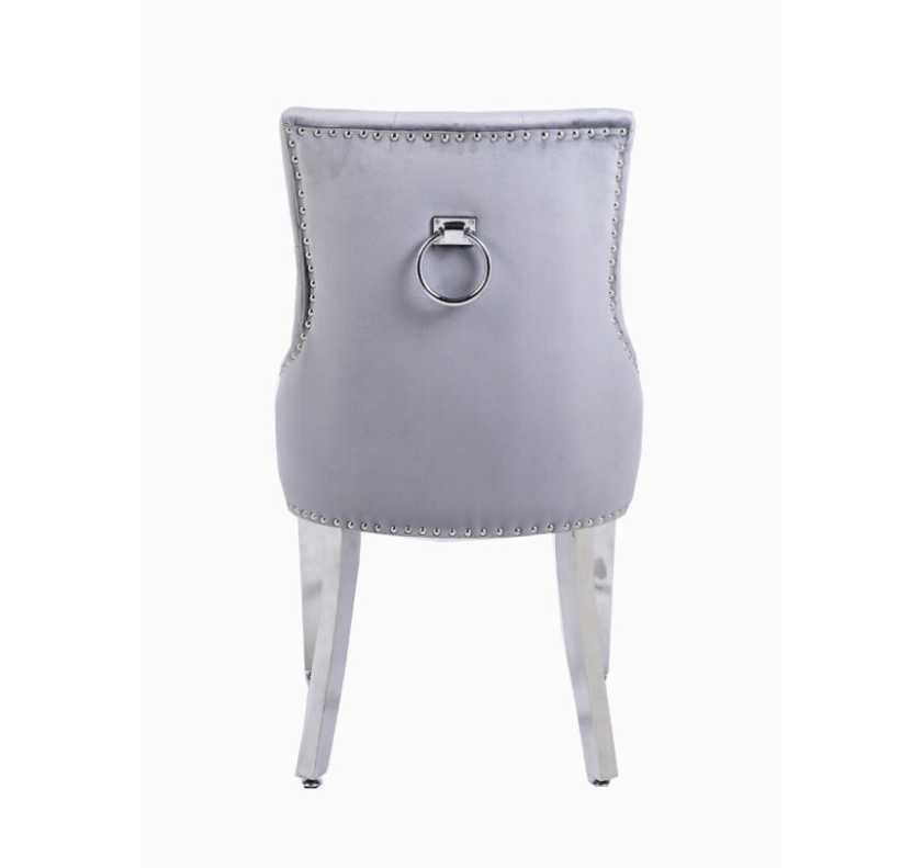 Back view of Valencia light grey PU leather dining chair with chrome legs and elegant ring knocker design UK furniture from Solid Furniture UK