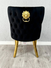 Back side view of Valentino black velvet dining chair featuring lion head knocker detail, gold-finished legs and luxury upholstered design by solid furniture uk
