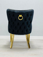 Back side view of Valentino black velvet dining chair featuring ring knocker detail, gold-finished legs and luxury upholstered design by solid furniture uk
