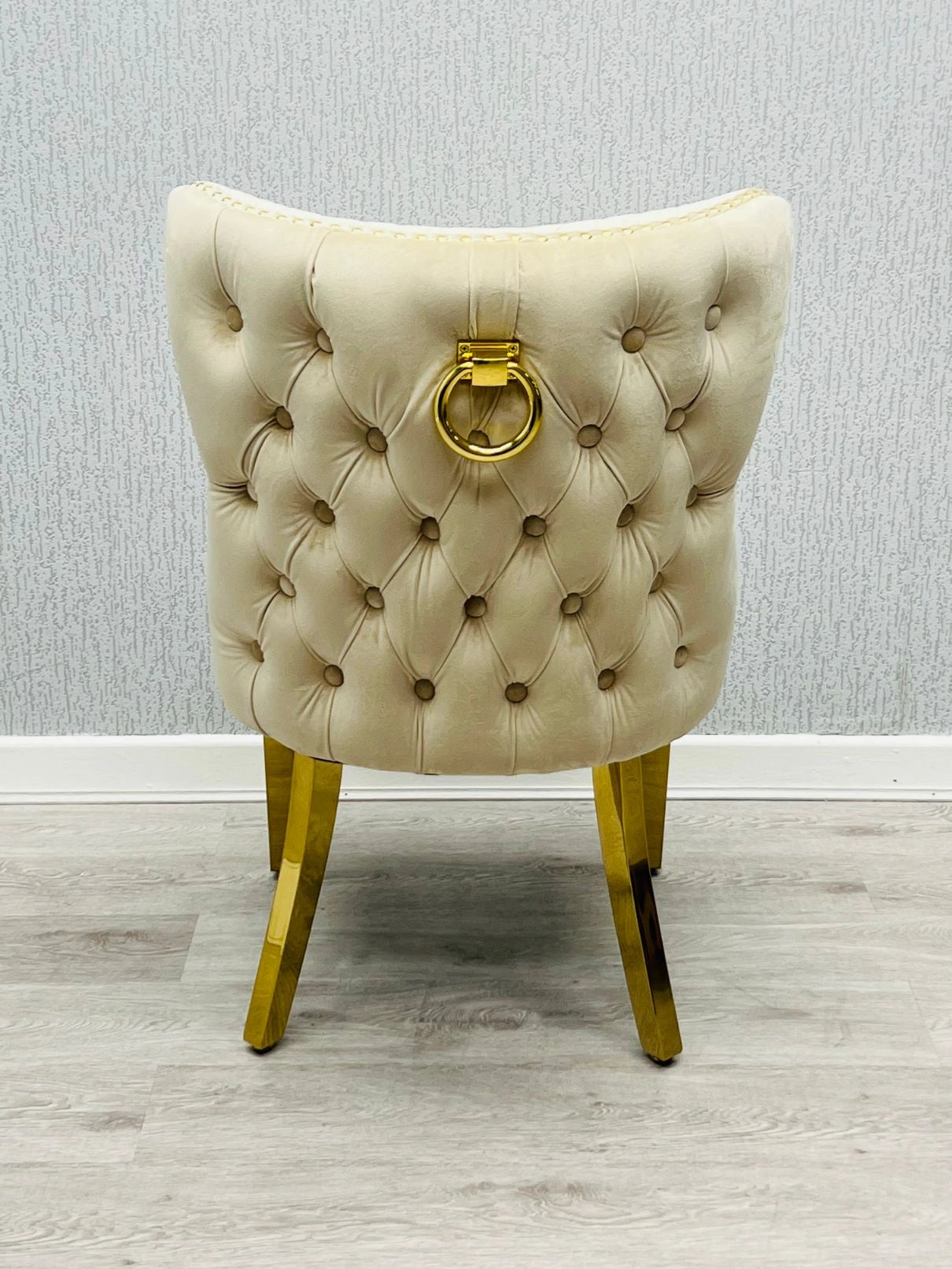 Back side view of Valentino mink velvet dining chair featuring ring knocker detail, gold-finished legs and luxury upholstered design by solid furniture uk