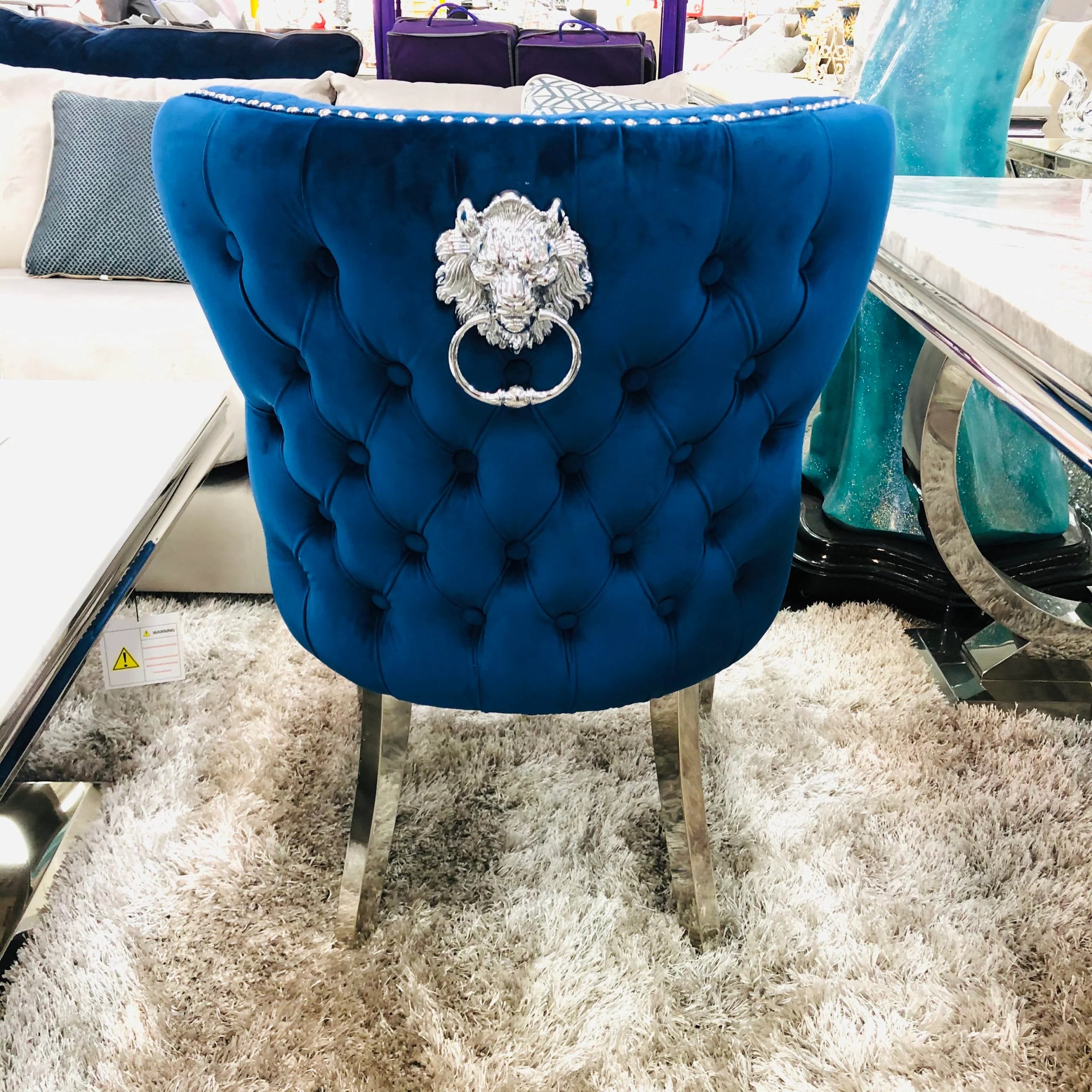 Solid Furniture UK back view of navy Valentino velvet dining chair with chrome legs and lion knocker