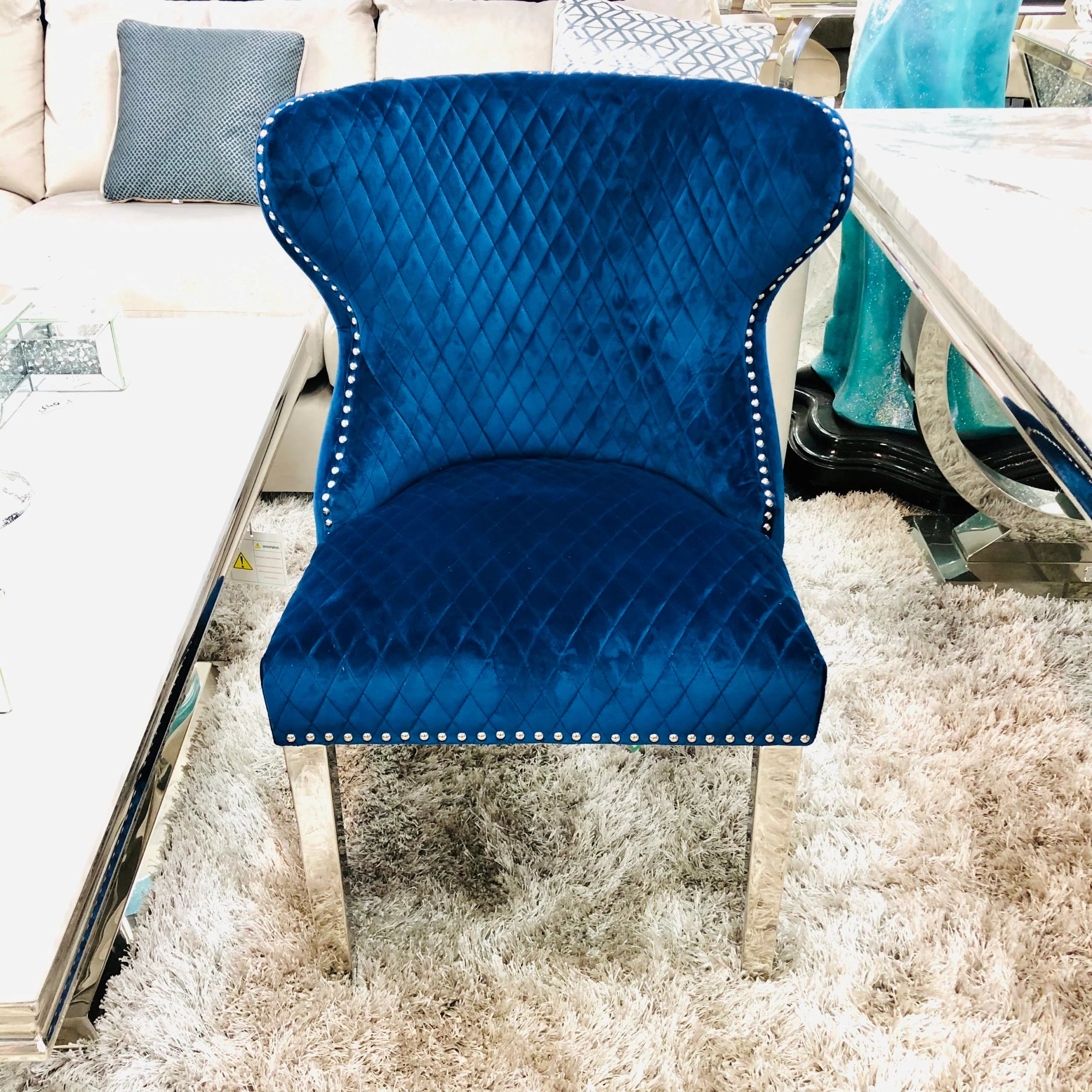 Solid Furniture UK navy Valentino velvet dining chair with chrome legs and lion knocker – main view