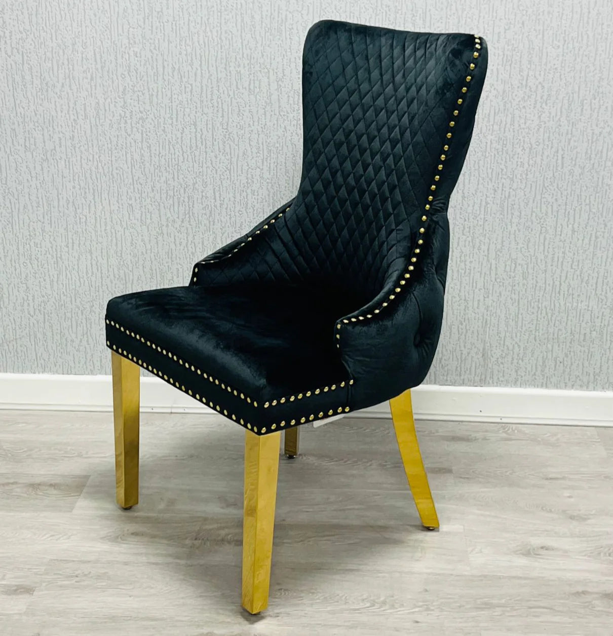 Victoria lion knocker chair black and gold front view from Solid Furniture UK, luxury upholstered dining chair with elegant lion knocker detail