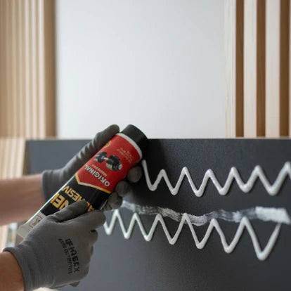 Easy application of wall panel adhesive using caulking gun for quick and secure wall panel installation by Solid Furniture LTD