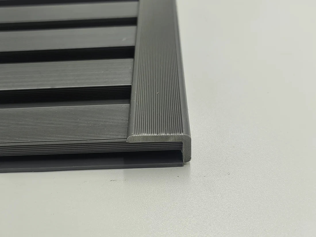 Vertical installation view of grey composite wall panel end trim 240cm installed on modern wall cladding from Solid Furniture Ltd UK