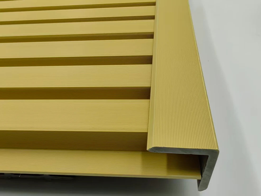 Angled view of oak wall panel end trim installed on outdoor decking and wall panels Solid Furniture LTD