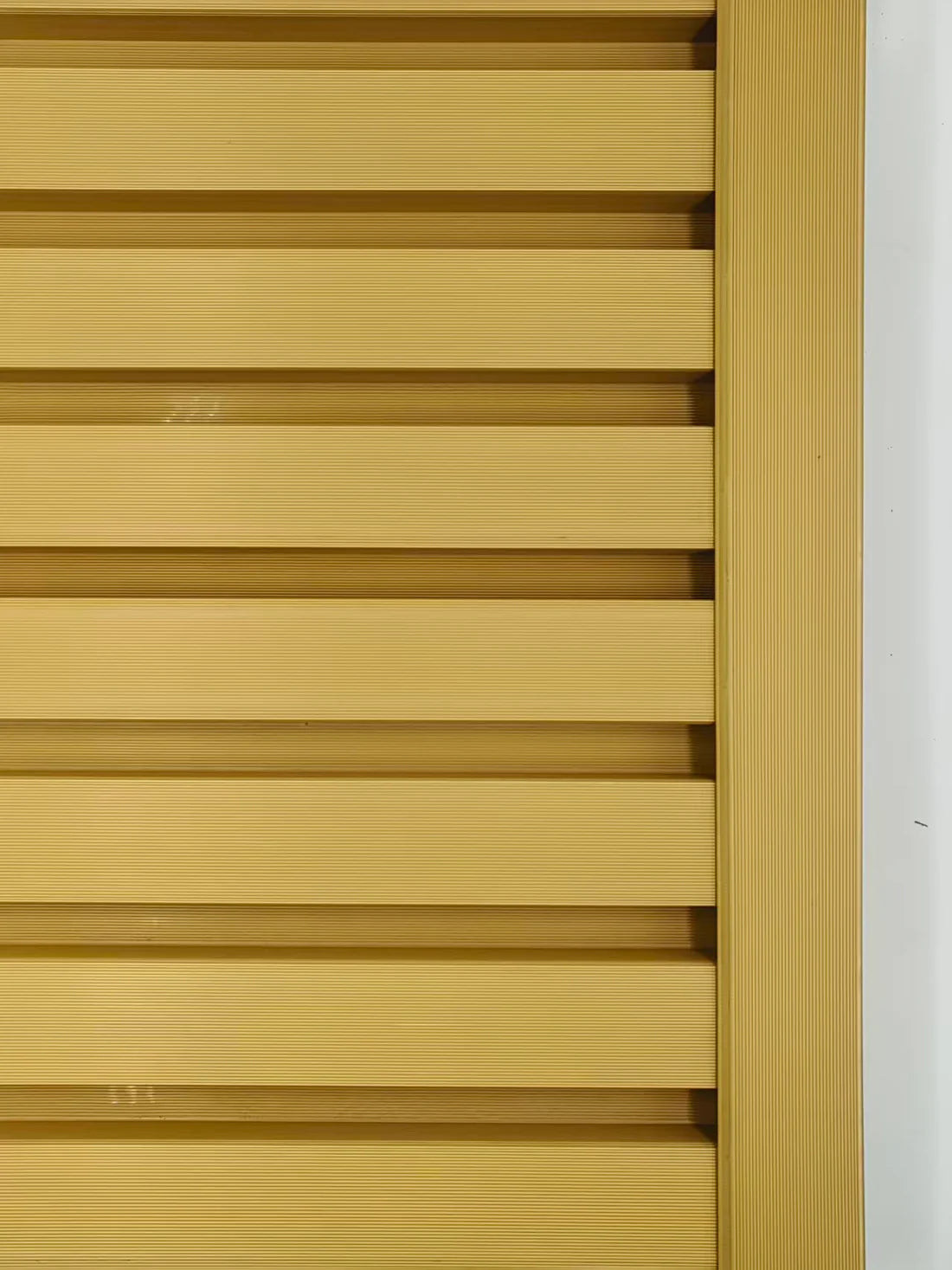 Wall panel end trim installed vertically on outdoor wall cladding oak finish Solid Furniture LTD