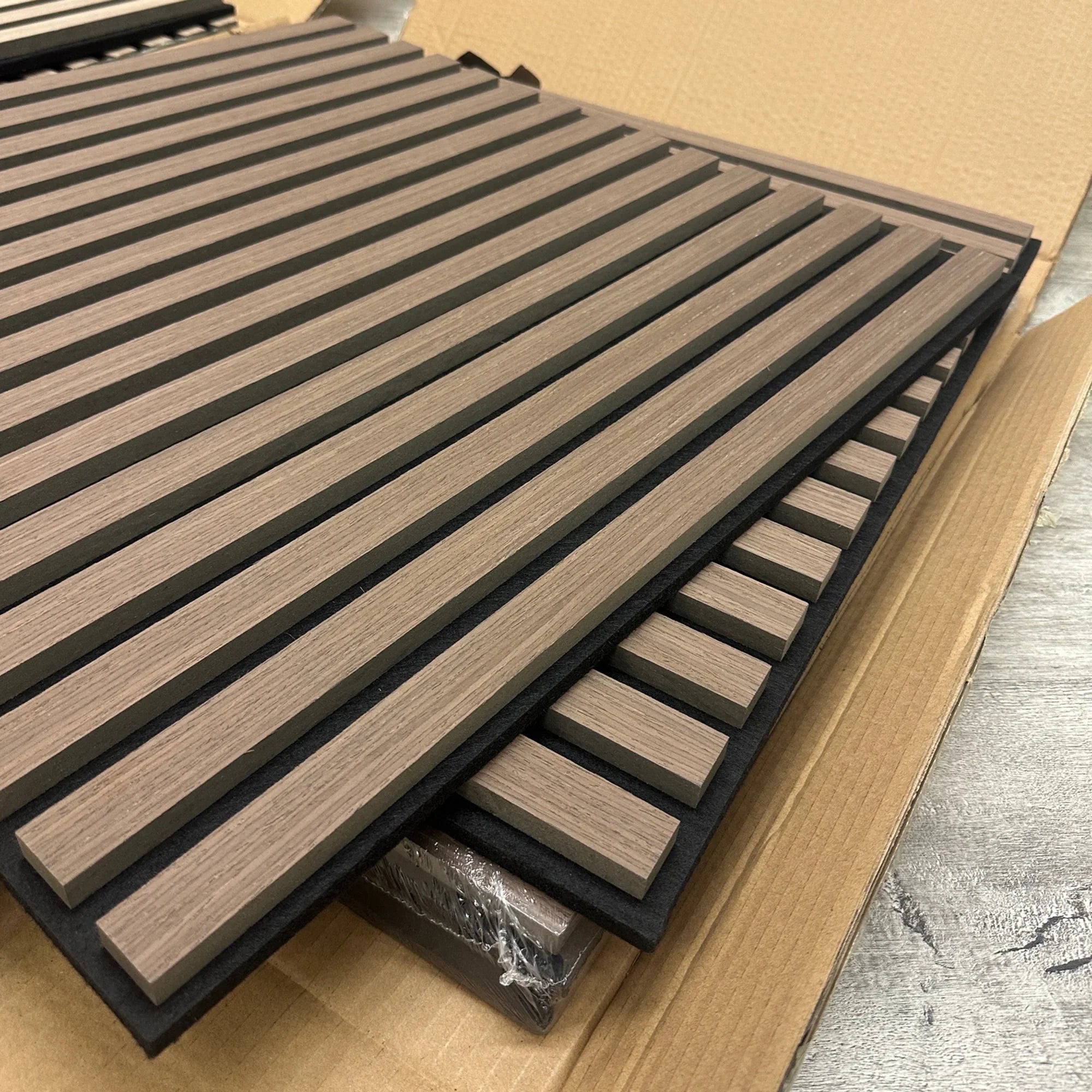 Angled view of 3D decorative walnut acoustic panels 60x60cm by Solid Furniture LTD showcasing depth, slat design, and modern wall aesthetics