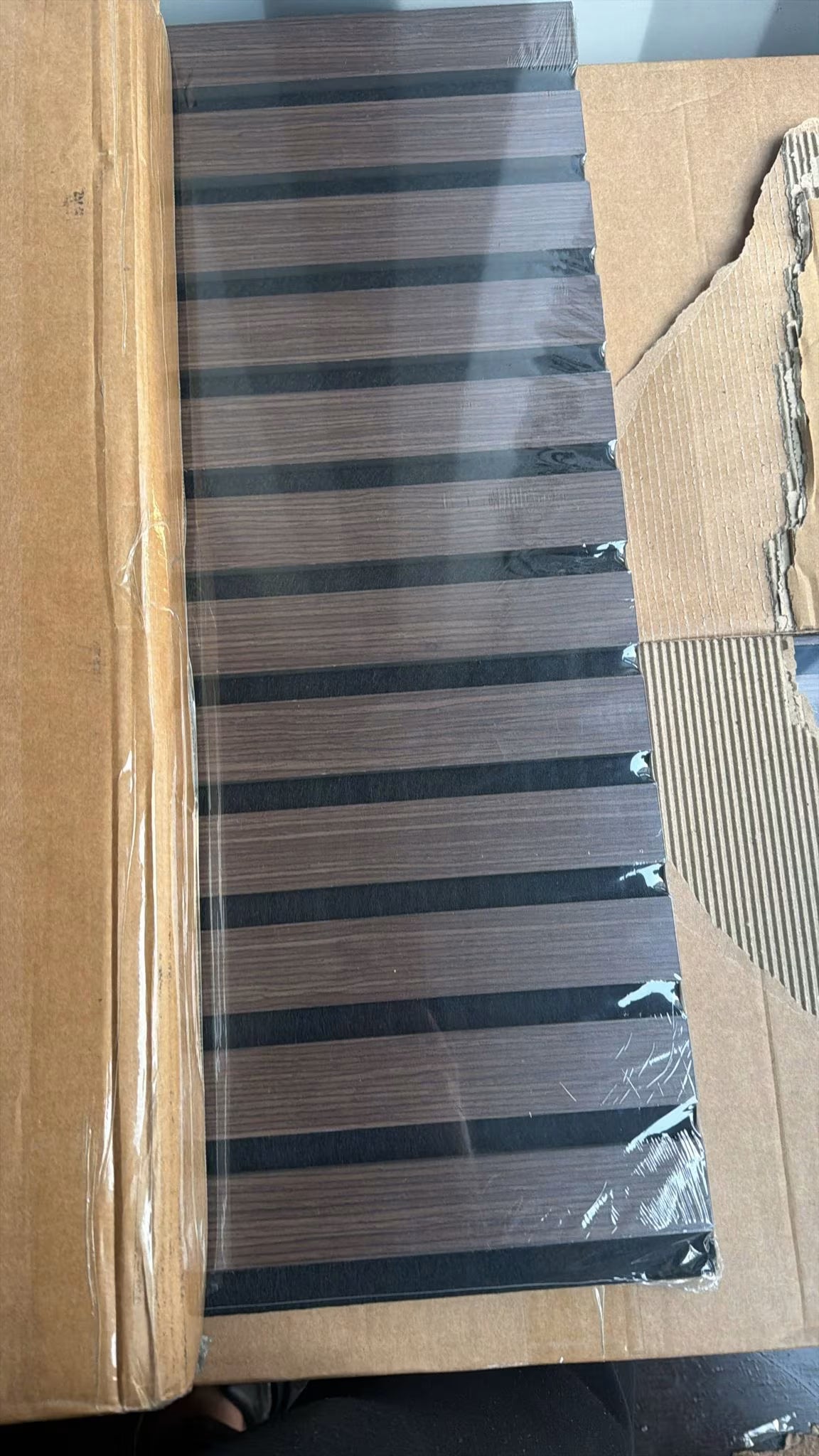 Original pic of 60x280 walnut acoustic wall panel UK displaying slatted design, high-density fiberboard build, and rich walnut finish. solid furniture UK