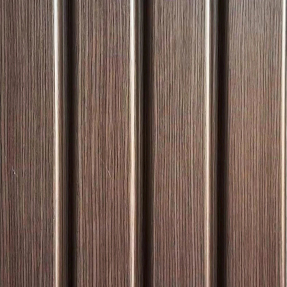 Close-up view of walnut seamless wall panels UK by Solid Furniture LTD highlighting detailed wood grain texture and smooth finish