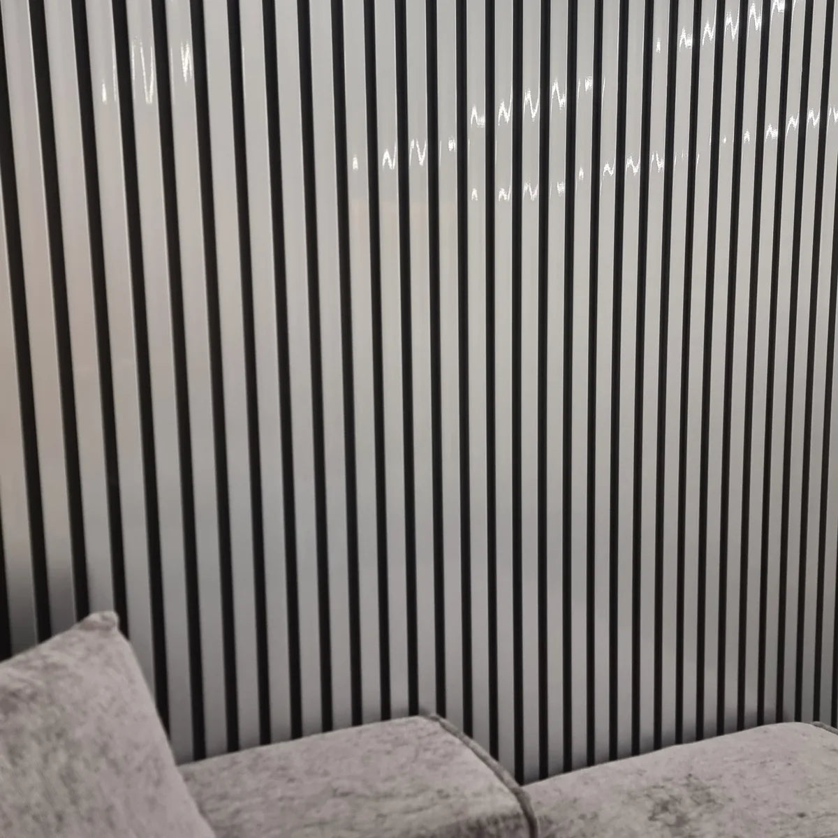 Waterproof chrome and black wood effect slatted WPC wall panels 15x240cm installed in a living room – Solid Furniture UK