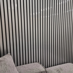 Waterproof chrome and black wood effect slatted WPC wall panels 15x240cm installed in a living room – Solid Furniture UK