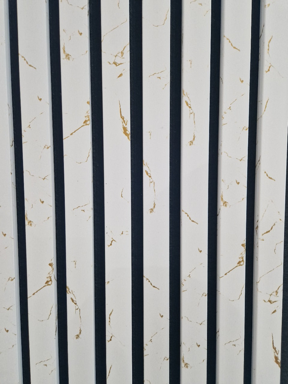 Close-up of 60x240cm White Gold Marble acoustic wall panel by Solid Furniture LTD showing marble texture and delicate gold dot accents