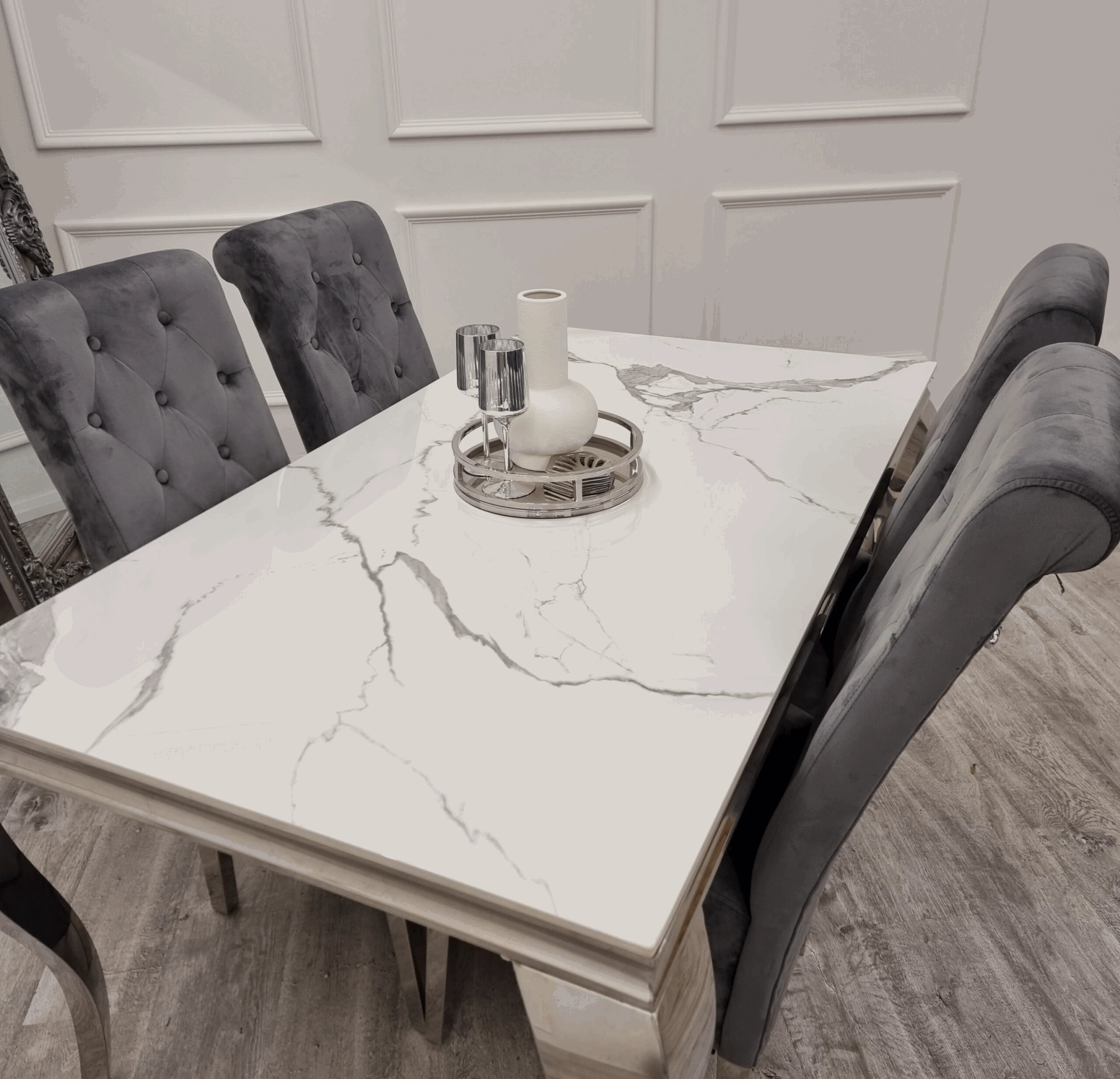Solid Furniture UK white Louis chrome dining set with dark grey velvet Sofia chairs side view