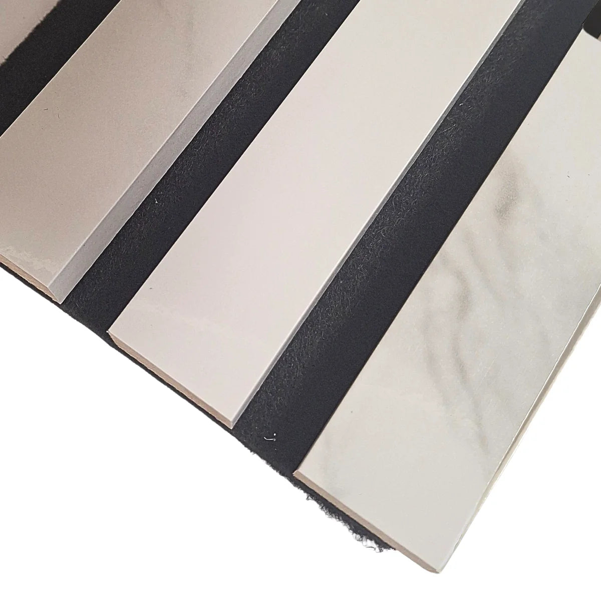 Close-up of white marble 3-sided acoustic slat wall panel 32 x 240 cm highlighting slat texture, spacing, and integrated acoustic felt backing. solid furniture UK