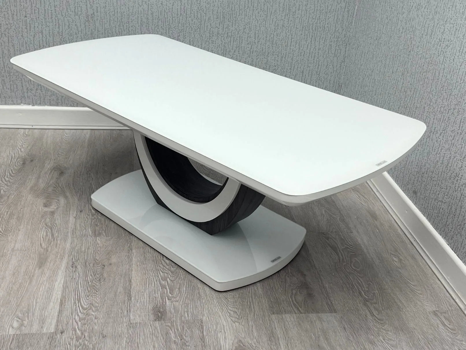 White Texas coffee table side view with high gloss top and U-shaped base | Solid Furniture UK