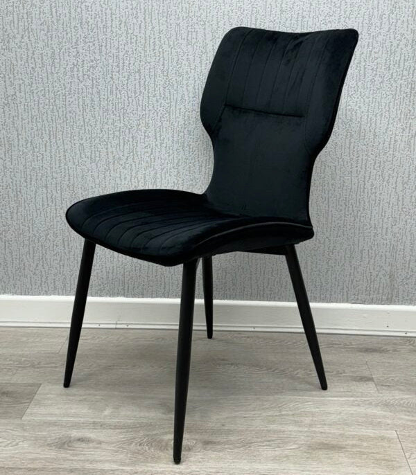 Side view of Black Windsor Velvet Dining Chairs showing sleek silhouette and durable frame from Solid Furniture UK