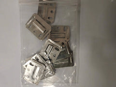Pack of 100 WPC wall panel brackets from Solid Furniture UK neatly arranged for bulk interior wall panel installation projects