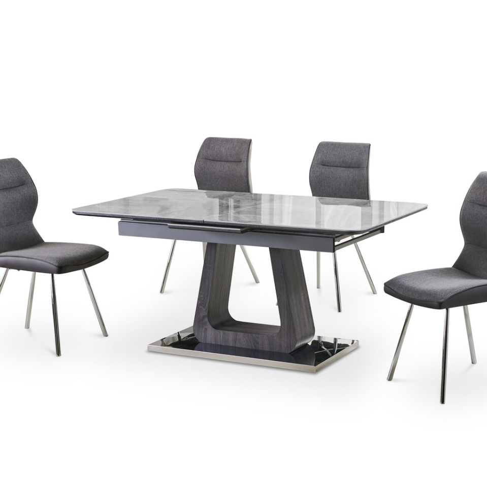 Zermatt 120cm grey ceramic dining table with 4 grey fabric chairs side view showing marble effect top chrome legs and complete dining set from Solid Furniture UK for modern UK homes