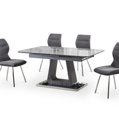 Zermatt 120cm grey ceramic dining table with 4 grey fabric chairs side view showing marble effect top chrome legs and complete dining set from Solid Furniture UK for modern UK homes