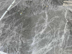 Close up of Zermatt grey ceramic dining table top with white marble effect veining from Solid Furniture UK featuring smooth and durable finish