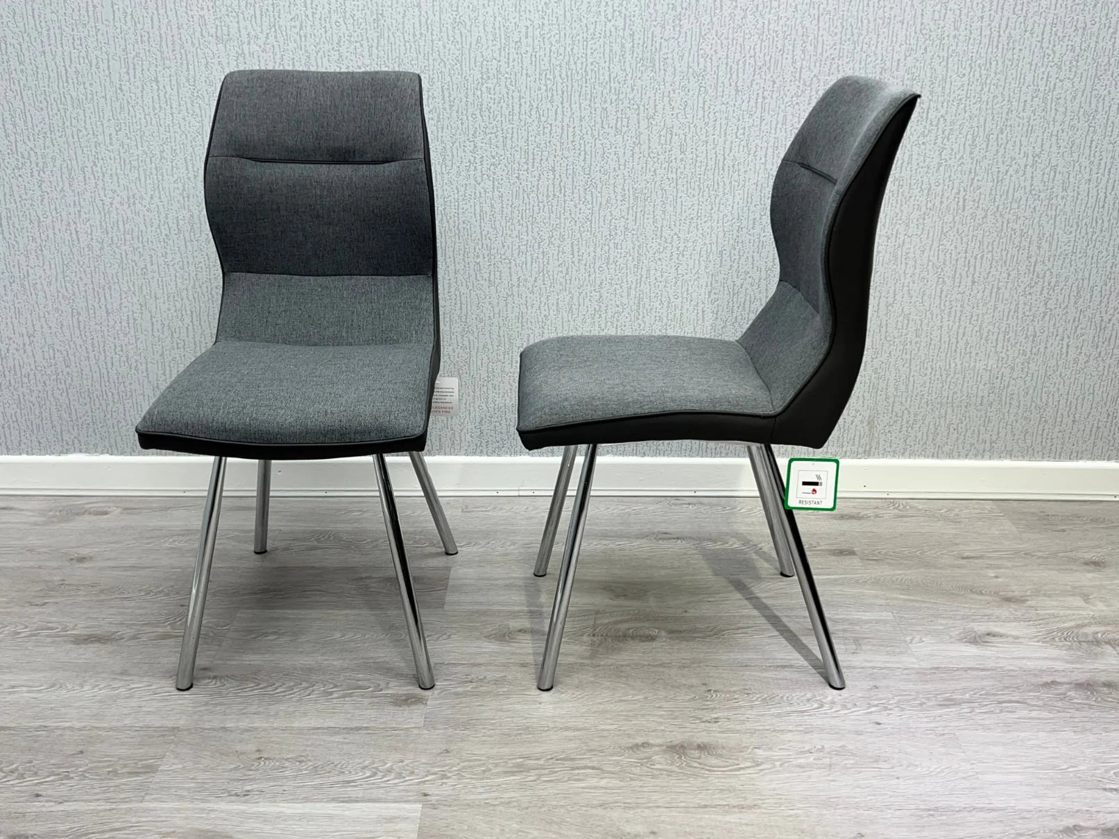 Pair of Zermatt dining chairs upholstered in grey fabric and PU leather with foam cushioning and chrome legs from Solid Furniture UK modern dining set